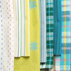 Collection of colorful fabric swatches with various patterns on a white background Warp & Weft Mystic Fable Yarn Dyed Woven Fabrics by Alexia Marcelle Abegg for Ruby Star Society for Moda Fabrics