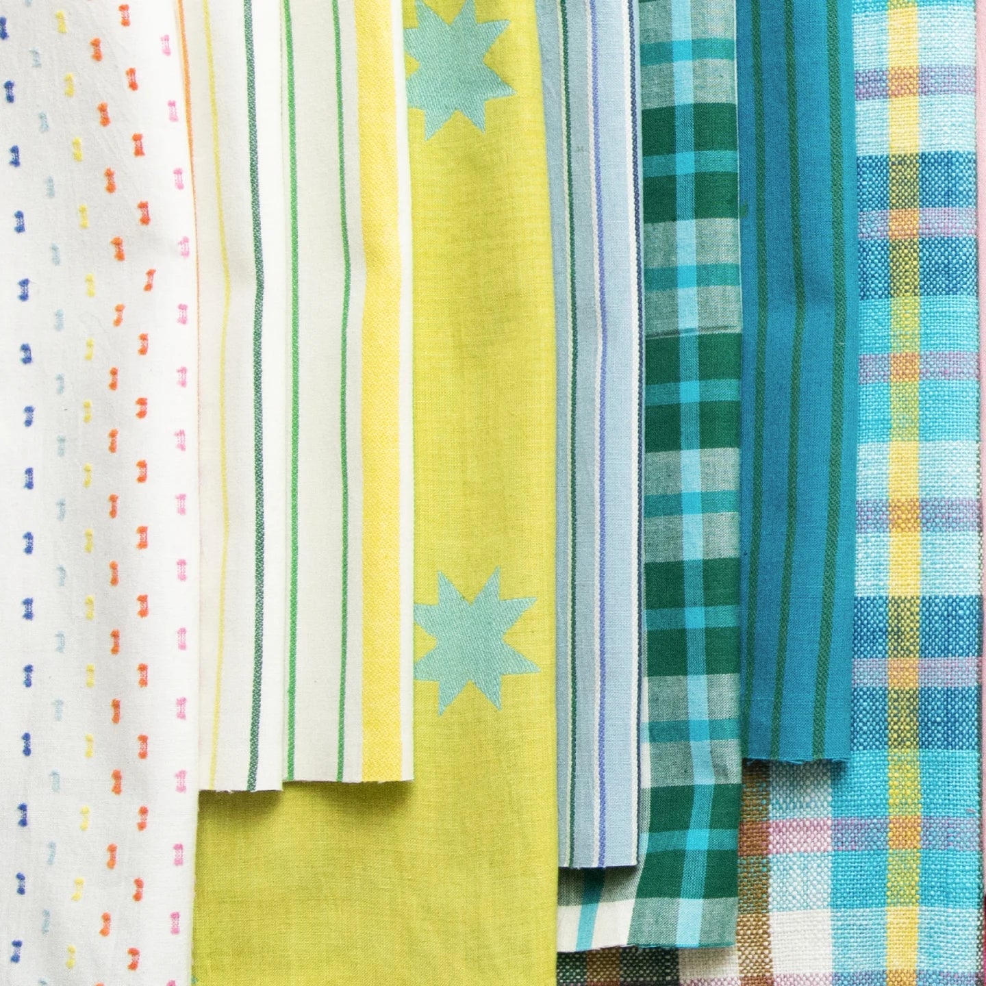 Collection of colorful fabric swatches with various patterns on a white background Warp & Weft Mystic Fable Yarn Dyed Woven Fabrics by Alexia Marcelle Abegg for Ruby Star Society for Moda Fabrics