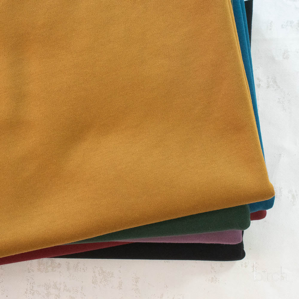 Ochre Solid Interlock Knit by Birch Organic