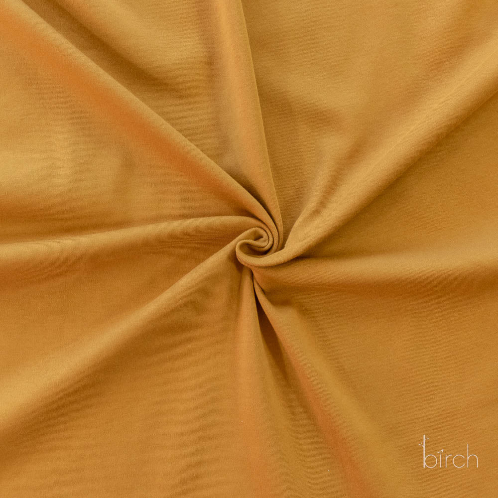 Ochre Solid Interlock Knit by Birch Organic