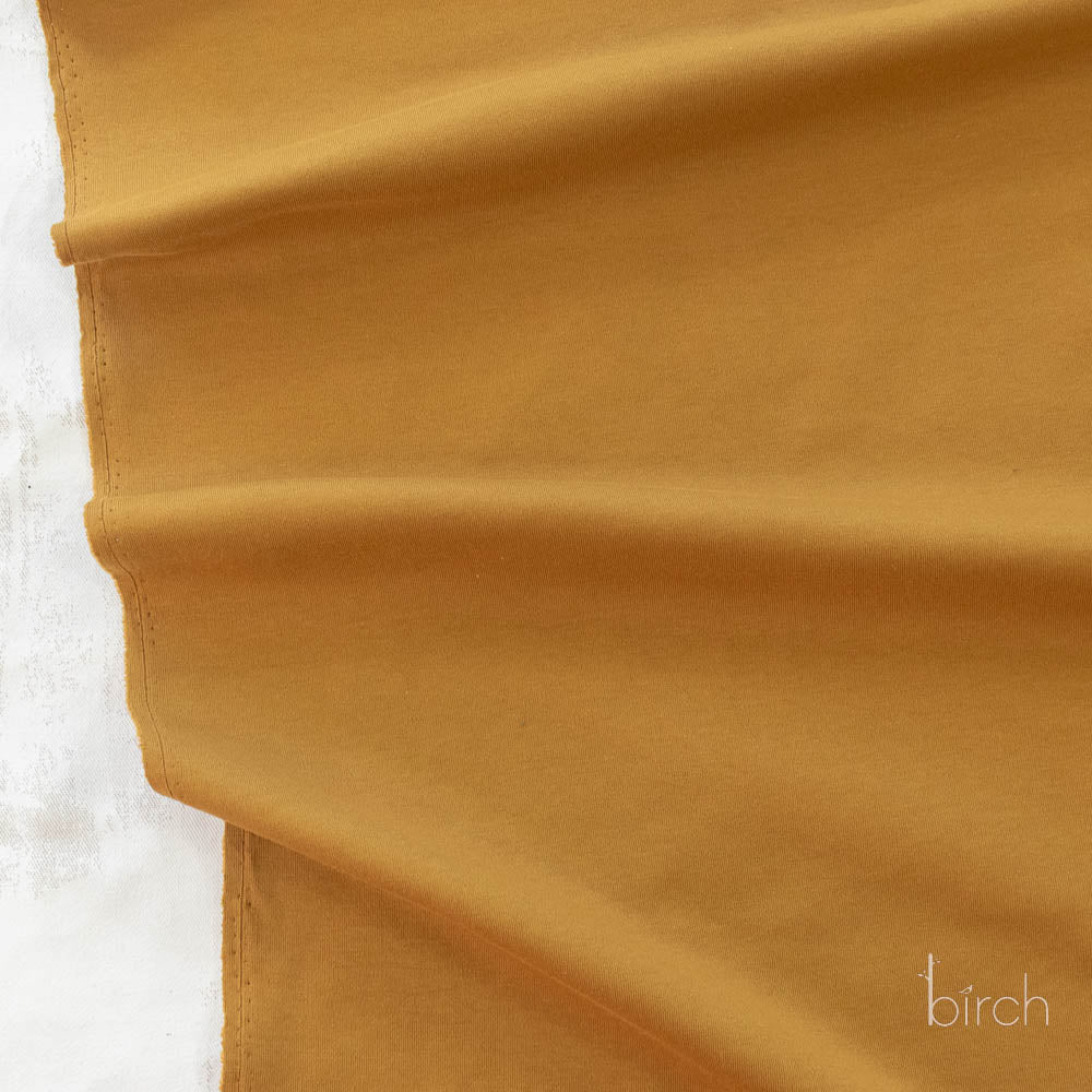 Ochre Solid Interlock Knit by Birch Organic